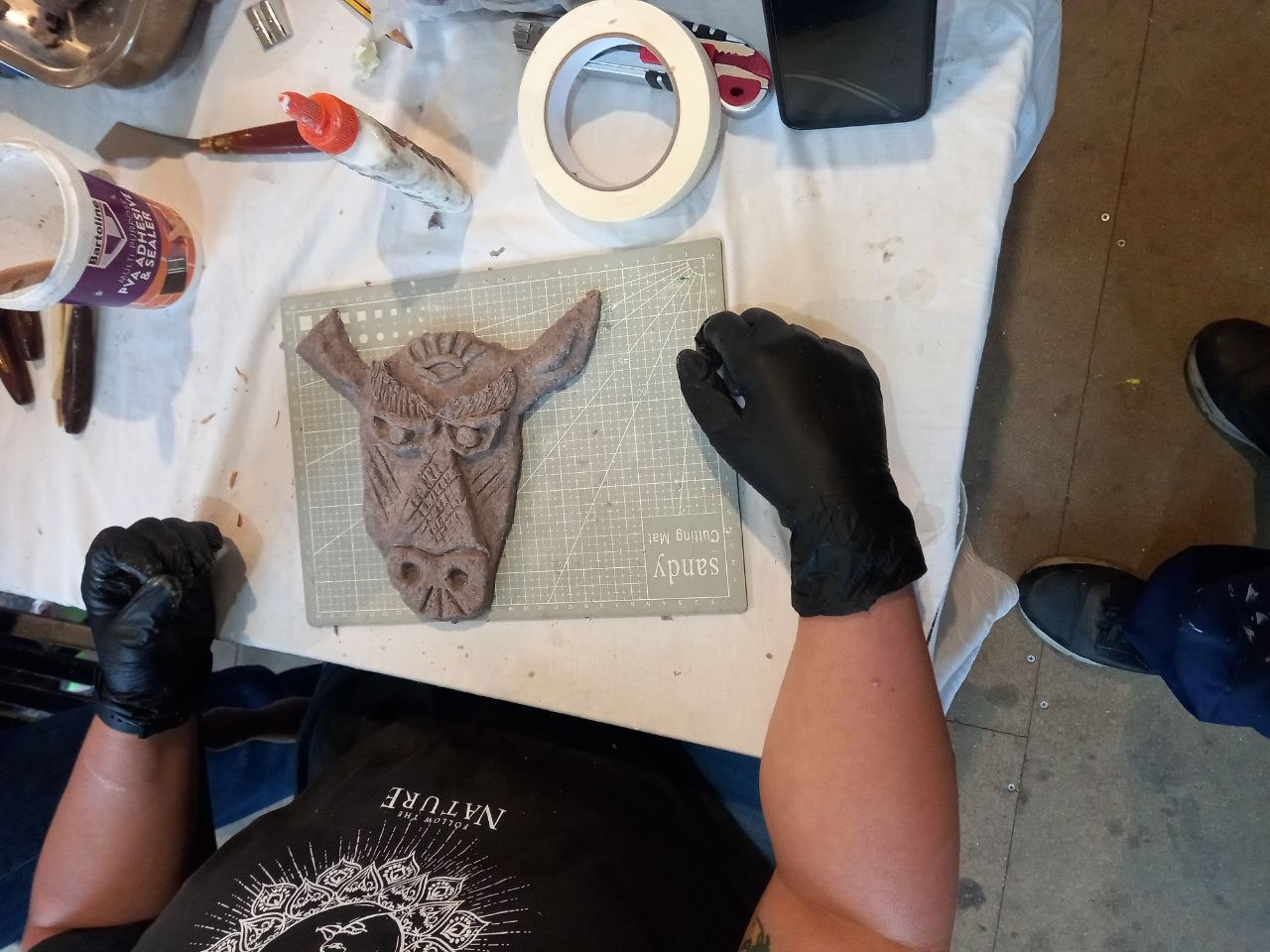 Detail of a clay animal-form sculpture in progress